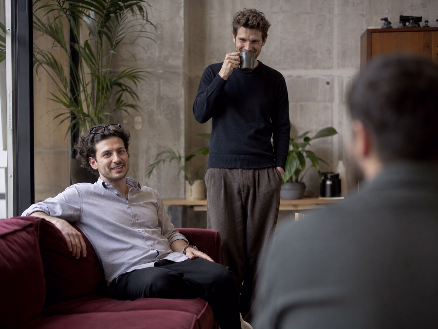 Team talking in an office lounge
