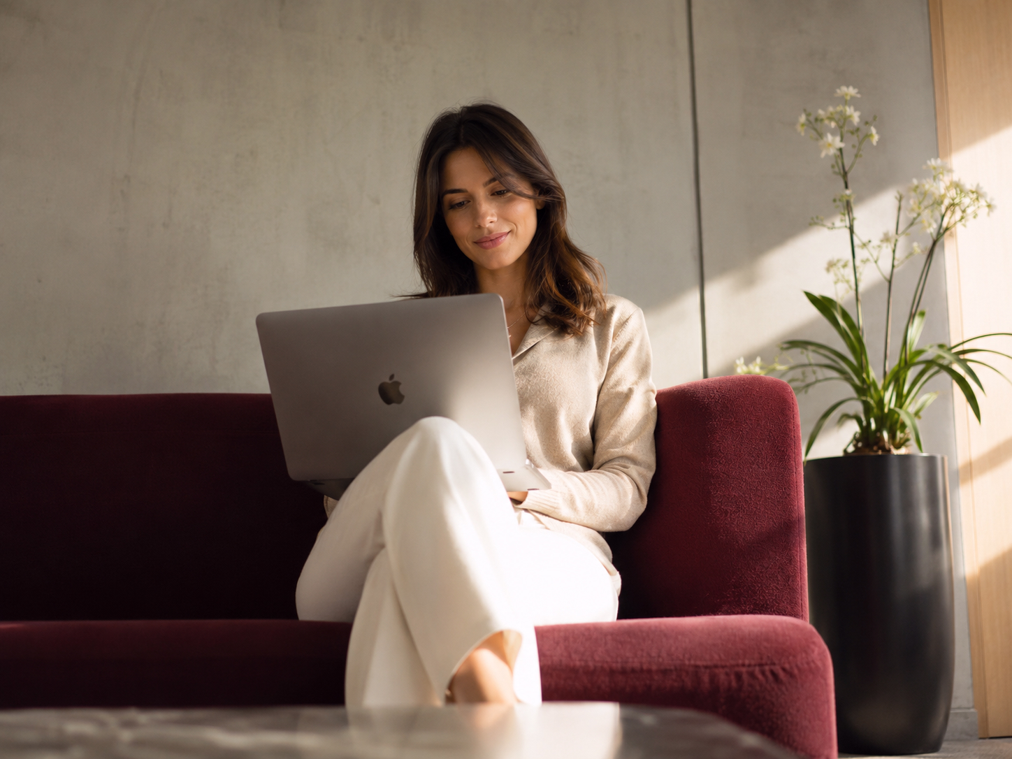 Founder working on a laptop in an office lounge